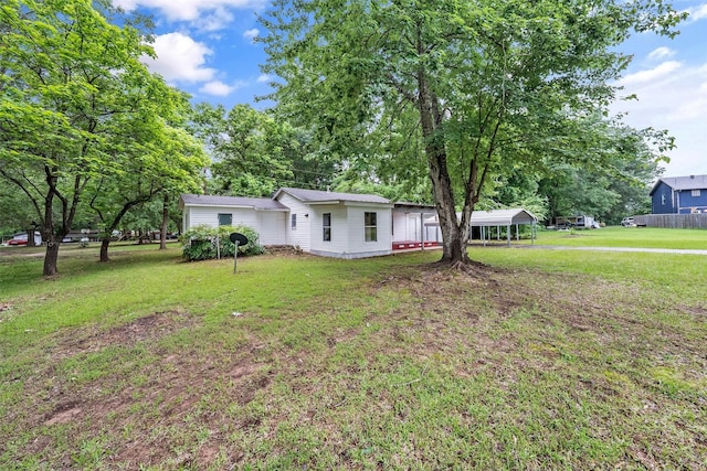 1621 Baseball Loop, Diana, TX 75640 - view of front facade with a front yard and a detached carport