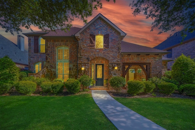 1364 Aubrey Ln, Frisco, TX 75033 - french country inspired facade featuring brick siding, a front yard, roof with shingles, and stone siding