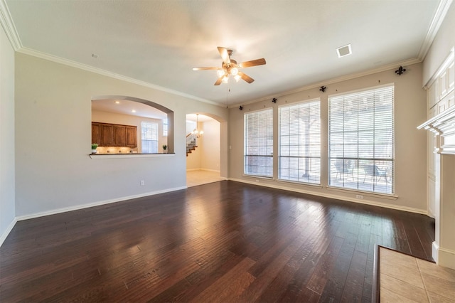 1364 Aubrey Ln, Frisco, TX 75033 - unfurnished living room with a ceiling fan, hardwood / wood-style flooring, arched walkways, baseboards, and crown molding