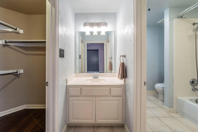 1364 Aubrey Ln, Frisco, TX 75033 - bathroom featuring toilet, bathtub / shower combination, vanity, baseboards, and tile patterned flooring