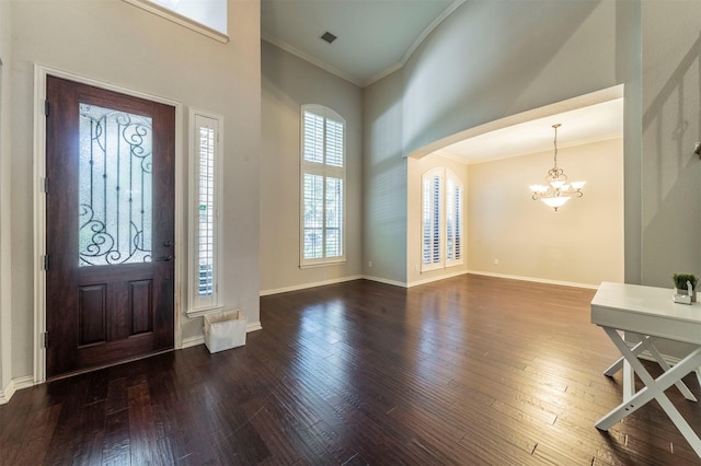 1364 Aubrey Ln, Frisco, TX 75033 - entryway featuring a chandelier, ornamental molding, a high ceiling, dark wood-type flooring, and baseboards