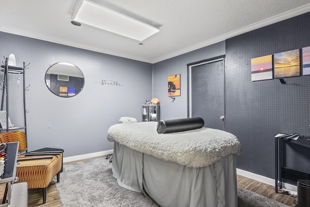 301 N Jefferson, Mount Pleasant, TX 75455 - bedroom featuring crown molding, wood finished floors, and baseboards