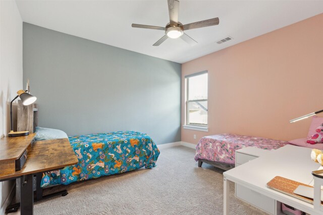 bedroom featuring carpet floors, baseboards, and a ceiling fan