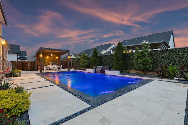 view of swimming pool featuring a patio, a fenced backyard, and outdoor dining area