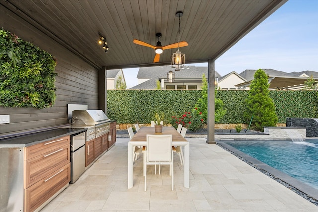 view of patio / terrace with exterior kitchen, a fenced backyard, grilling area, outdoor dining space, and ceiling fan