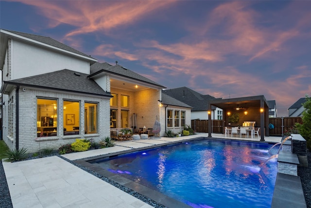 view of swimming pool featuring a patio area and a fenced backyard