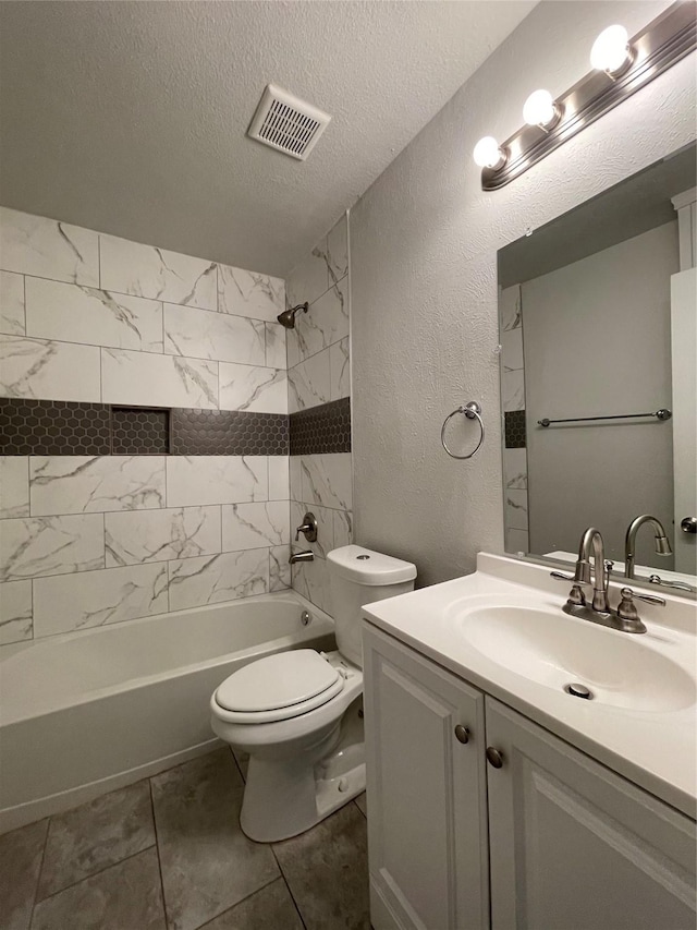 full bathroom featuring a textured wall, toilet, a textured ceiling, shower / bath combination, and vanity