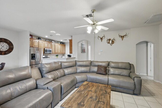 bedroom featuring light tile patterned floors and ceiling fan