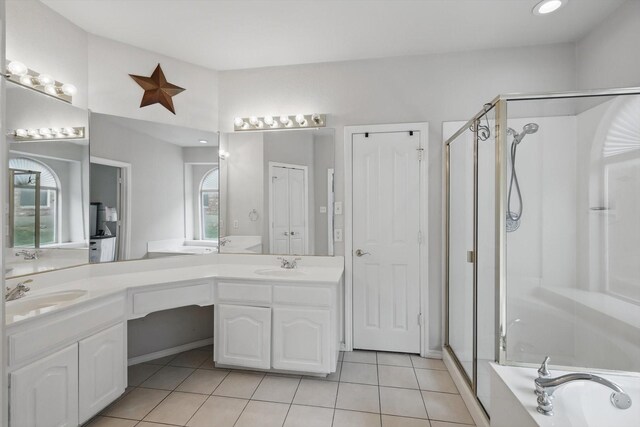 ensuite bathroom featuring a stall shower, tile patterned floors, a bath, vanity, and recessed lighting