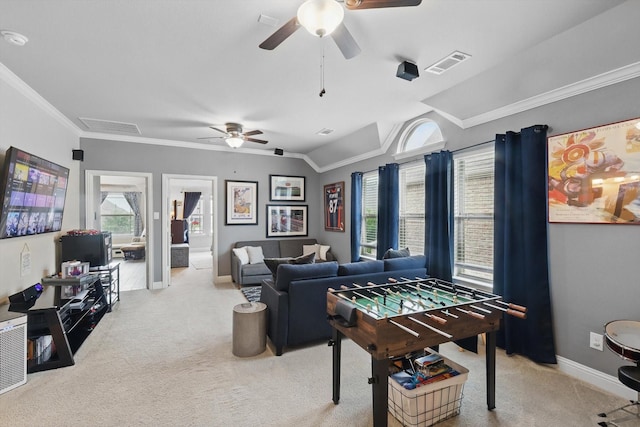 playroom featuring ceiling fan, light carpet, baseboards, ornamental molding, and lofted ceiling