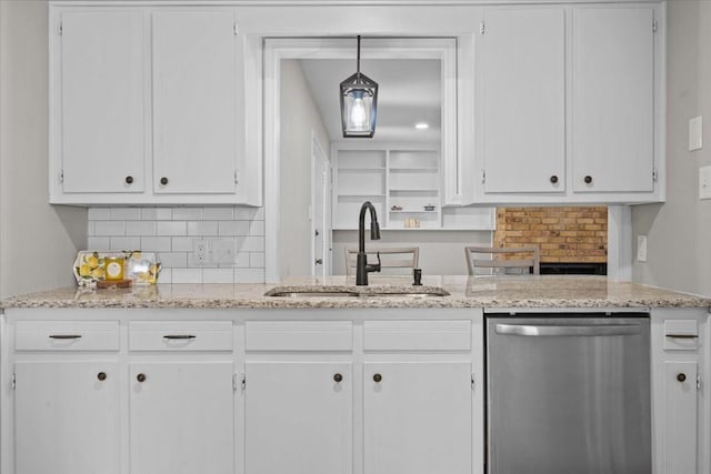 3205 Creekwood Cir, Waco, TX 76710 - kitchen featuring dishwasher, a sink, white cabinets, decorative backsplash, and light stone counters