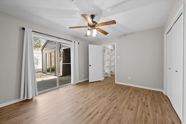 3205 Creekwood Cir, Waco, TX 76710 - unfurnished bedroom with access to outside, wood finished floors, baseboards, a closet, and ceiling fan