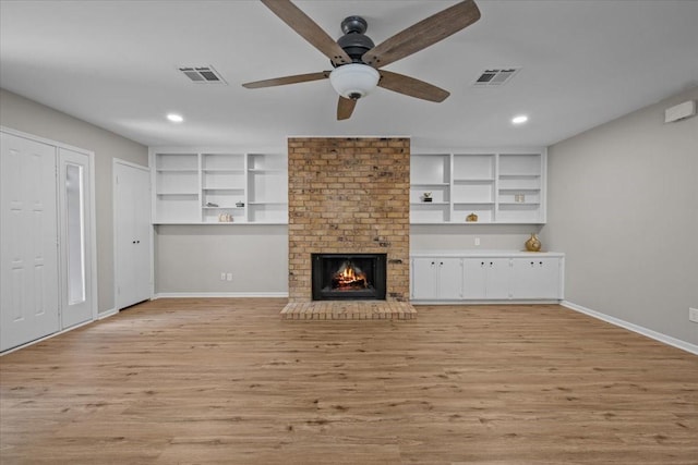 3205 Creekwood Cir, Waco, TX 76710 - unfurnished living room with ceiling fan, recessed lighting, light wood-style floors, baseboards, and a fireplace