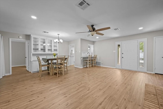 3205 Creekwood Cir, Waco, TX 76710 - entryway with a ceiling fan, recessed lighting, light wood-style floors, baseboards, and a chandelier