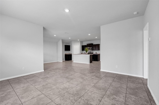 16509 Portage St, Justin, TX 76247 - unfurnished living room with recessed lighting, light tile patterned floors, and baseboards