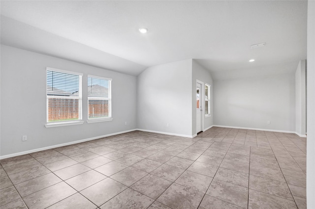 16509 Portage St, Justin, TX 76247 - tiled spare room featuring healthy amount of natural light, recessed lighting, vaulted ceiling, and baseboards