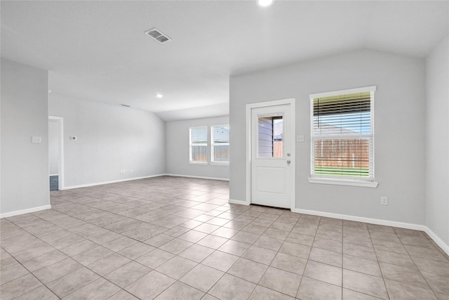 16509 Portage St, Justin, TX 76247 - spare room with vaulted ceiling, light tile patterned flooring, baseboards, and recessed lighting