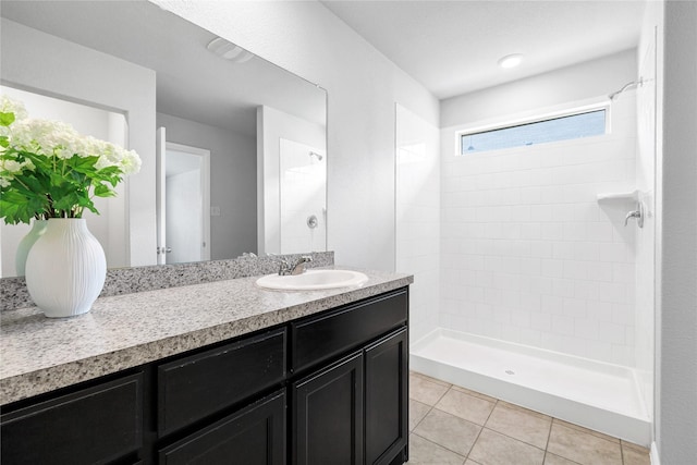16509 Portage St, Justin, TX 76247 - full bath with tiled shower, vanity, and tile patterned flooring