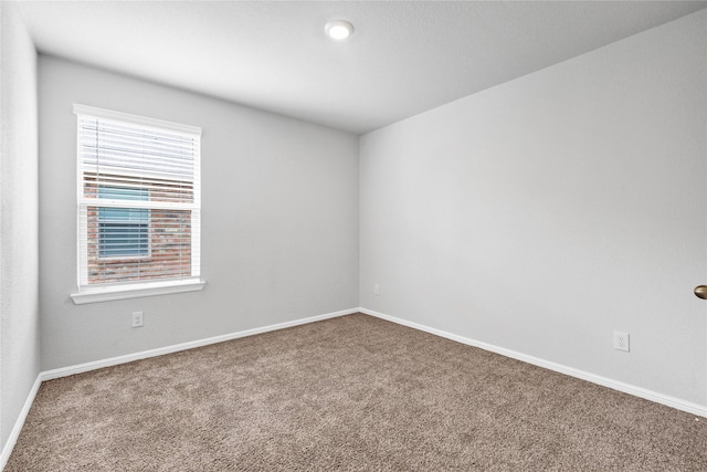 16509 Portage St, Justin, TX 76247 - carpeted spare room featuring baseboards