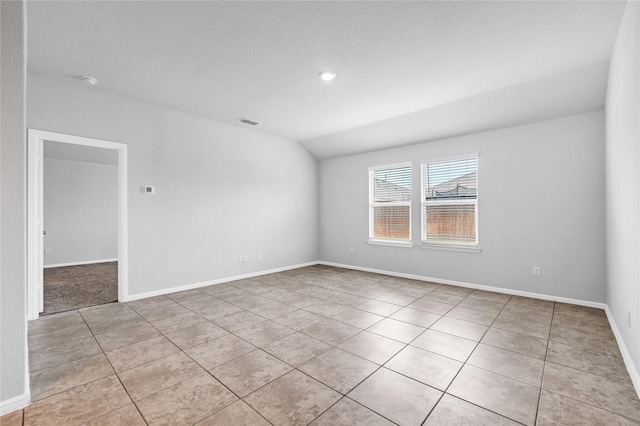 16509 Portage St, Justin, TX 76247 - spare room with light tile patterned floors, lofted ceiling, baseboards, and recessed lighting