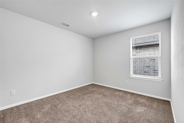 16509 Portage St, Justin, TX 76247 - spare room featuring carpet and baseboards