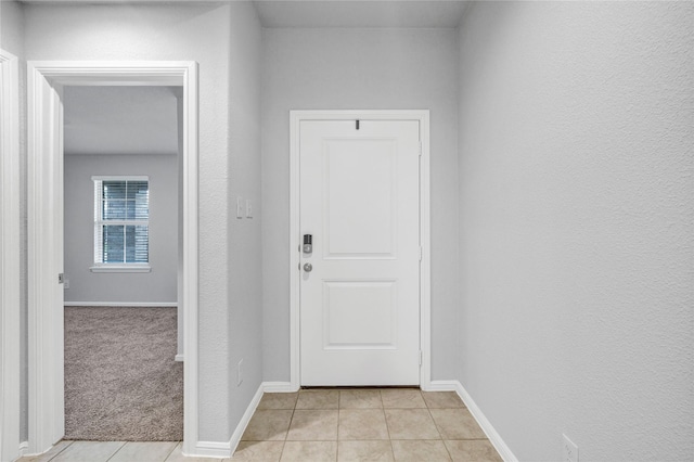 16509 Portage St, Justin, TX 76247 - entryway featuring light tile patterned floors and baseboards