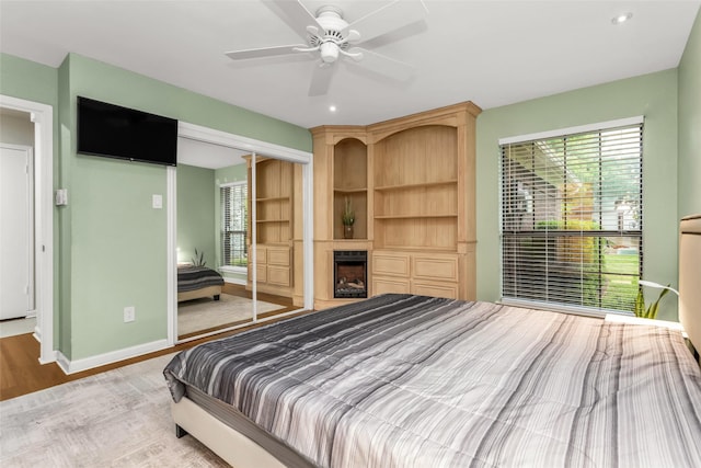 3841 Beaumont Ln, Plano, TX 75023 - bedroom with a closet, wood finished floors, baseboards, recessed lighting, and a ceiling fan