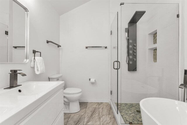 3841 Beaumont Ln, Plano, TX 75023 - full bathroom with a stall shower, vanity, a soaking tub, and baseboards