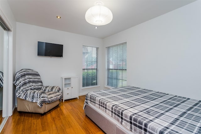 3841 Beaumont Ln, Plano, TX 75023 - bedroom featuring wood finished floors, recessed lighting, and a closet