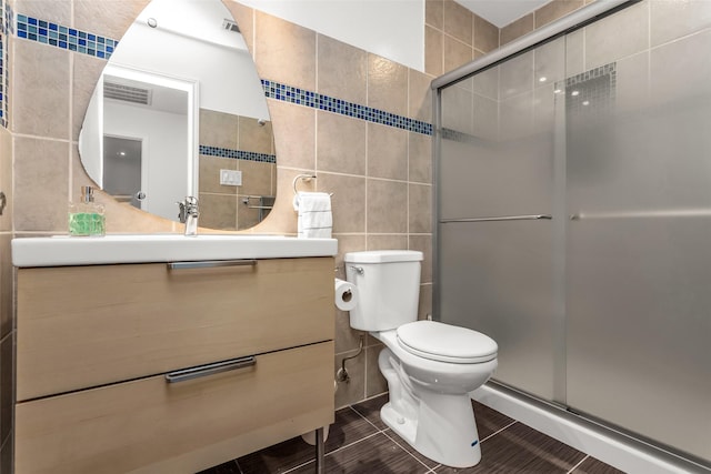 3841 Beaumont Ln, Plano, TX 75023 - full bath featuring tile walls, pet washing station, a shower stall, toilet, and vanity