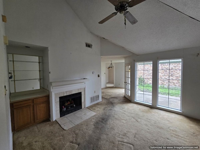 4115 Hollow Oak Dr, Dallas, TX 75287 - unfurnished living room featuring carpet flooring, ceiling fan, a tiled fireplace, high vaulted ceiling, and baseboards
