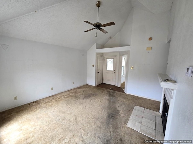 4115 Hollow Oak Dr, Dallas, TX 75287 - unfurnished living room with a ceiling fan, carpet, high vaulted ceiling, a fireplace with flush hearth, and baseboards