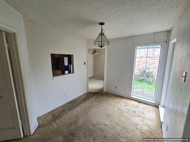 4115 Hollow Oak Dr, Dallas, TX 75287 - unfurnished dining area with carpet flooring and a textured ceiling