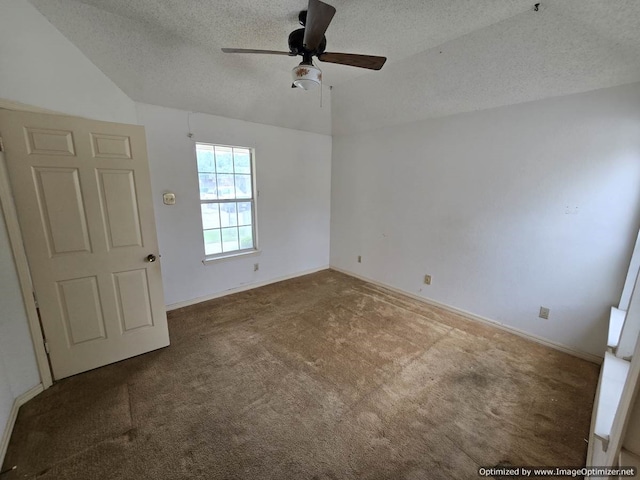 4115 Hollow Oak Dr, Dallas, TX 75287 - empty room featuring a textured ceiling, carpet floors, vaulted ceiling, ceiling fan, and baseboards