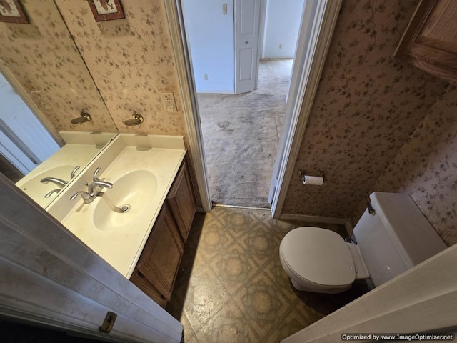 4115 Hollow Oak Dr, Dallas, TX 75287 - half bath with wallpapered walls, toilet, tile patterned floors, vanity, and baseboards