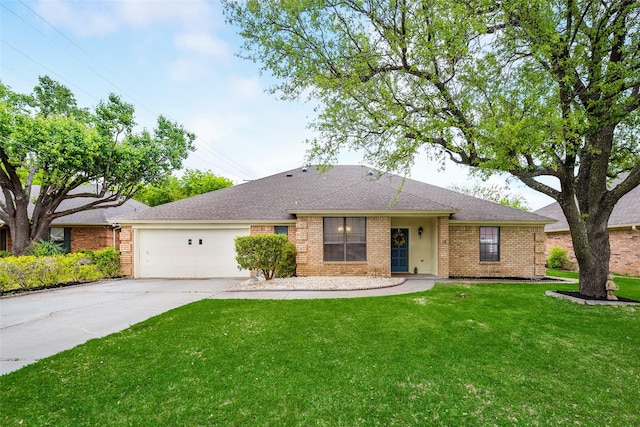 ranch-style house featuring a garage, brick siding, driveway, a front lawn, and roof with shingles
