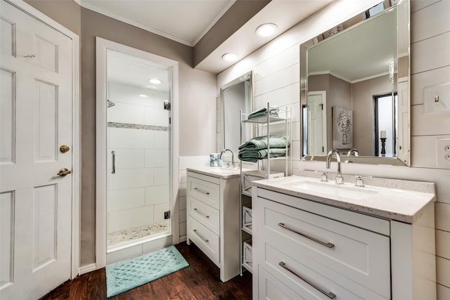 full bath featuring crown molding, a stall shower, wood finished floors, vanity, and recessed lighting