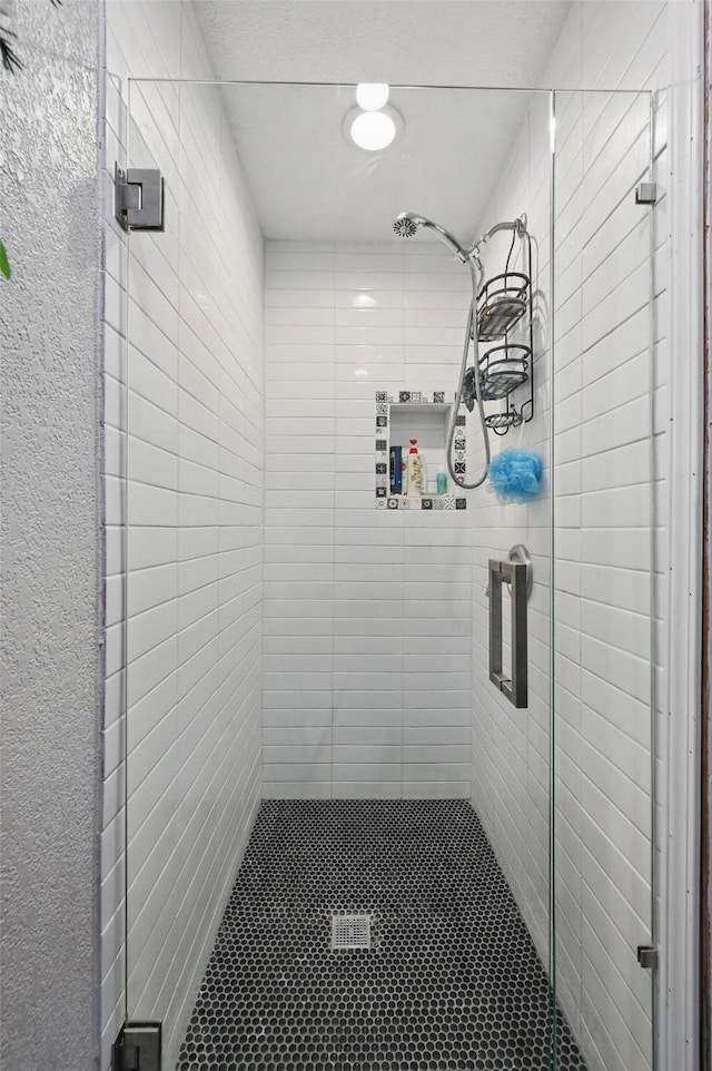 full bath with a shower stall