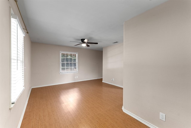 6838 Lupton Dr, Dallas, TX 75225 - unfurnished room with wood finished floors, ceiling fan, and baseboards