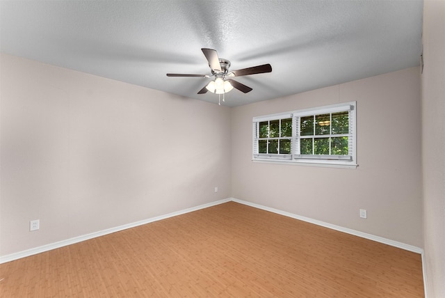 6838 Lupton Dr, Dallas, TX 75225 - spare room featuring a ceiling fan, baseboards, and wood finished floors