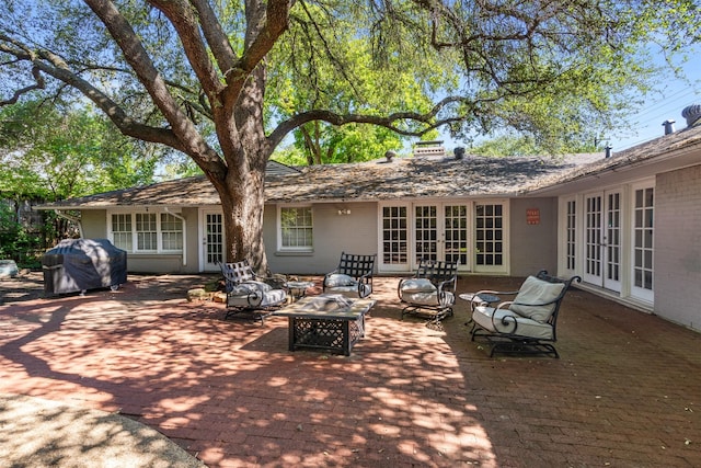 6838 Lupton Dr, Dallas, TX 75225 - view of patio featuring french doors, area for grilling, and an outdoor living space
