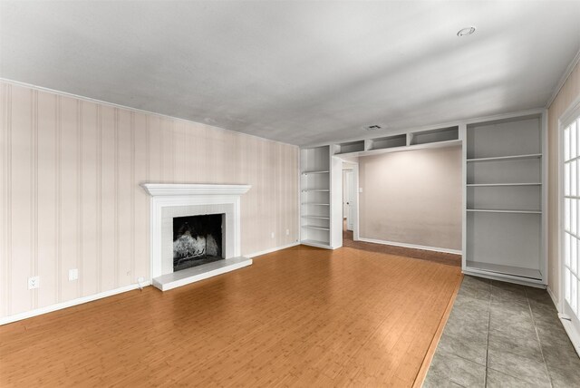 6838 Lupton Dr, Dallas, TX 75225 - unfurnished living room featuring a fireplace and baseboards