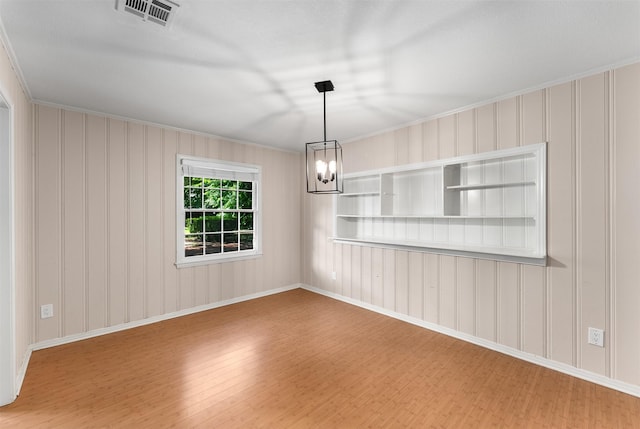 6838 Lupton Dr, Dallas, TX 75225 - spare room featuring wood finished floors, crown molding, a chandelier, and baseboards