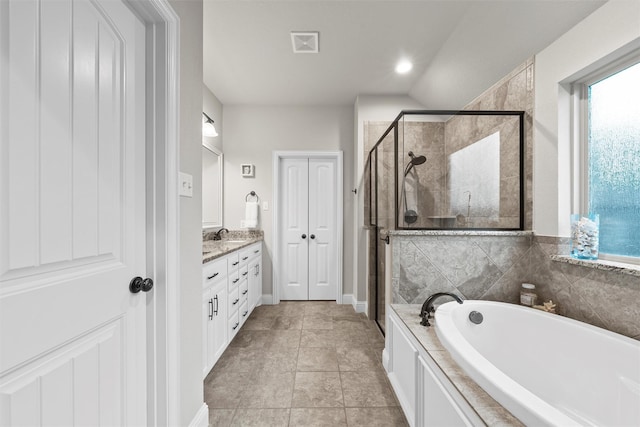 full bathroom with a shower stall, a bath, vanity, and recessed lighting