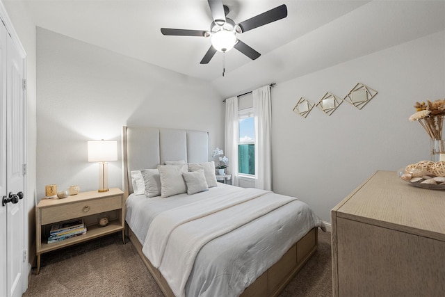 bedroom featuring carpet, vaulted ceiling, and ceiling fan