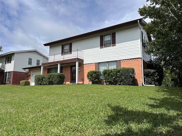 1664 Poplar Dr, Mesquite, TX 75149 - traditional-style house with a garage, a balcony, brick siding, and a front yard