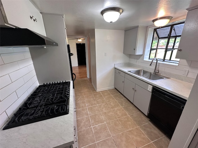 1664 Poplar Dr, Mesquite, TX 75149 - kitchen with a sink, stovetop, dishwasher, light tile patterned floors, and light countertops