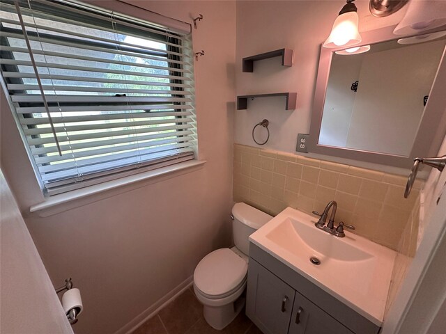 1664 Poplar Dr, Mesquite, TX 75149 - bathroom featuring toilet, tile patterned flooring, vanity, and tile walls