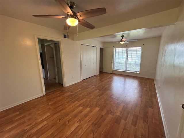 1664 Poplar Dr, Mesquite, TX 75149 - unfurnished bedroom featuring wood finished floors, baseboards, and ceiling fan