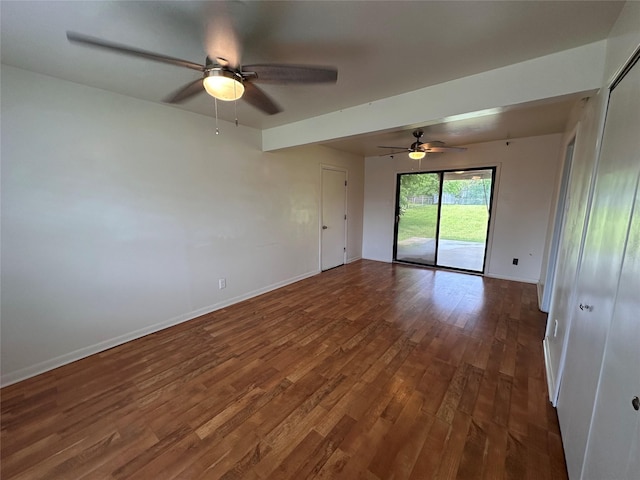 1664 Poplar Dr, Mesquite, TX 75149 - spare room featuring dark wood-type flooring, ceiling fan, and baseboards